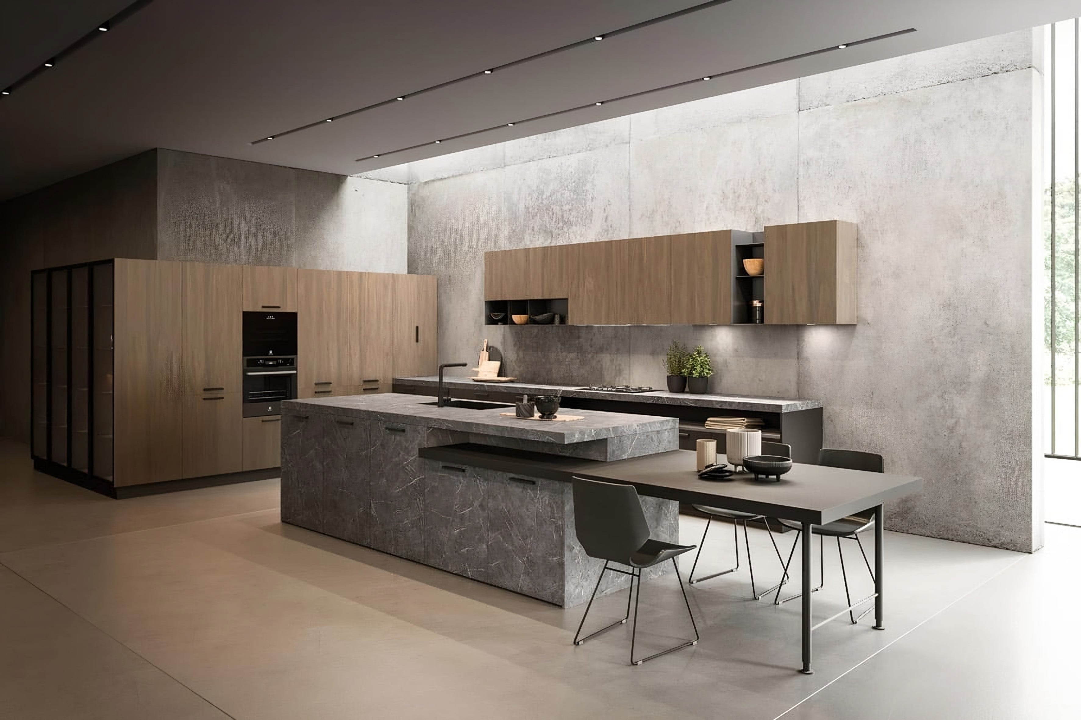 Cuisine Armony Rho : îlot effet pierre grise, colonnes et meubles hauts en noyer, mur en béton